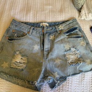 Never worn star print jean shorts.